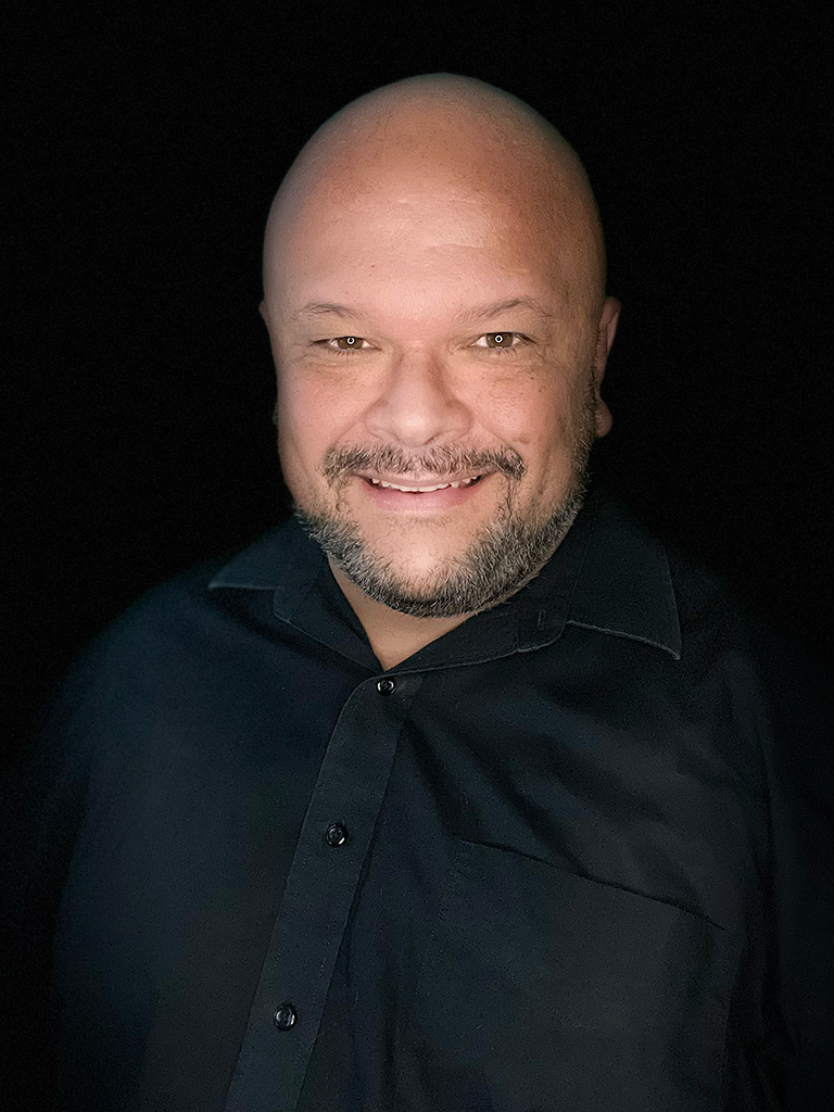 bald man wearing black shirt